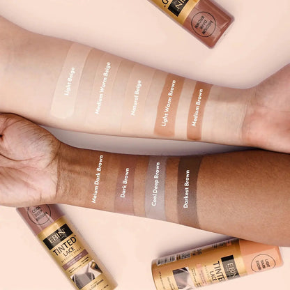 Swatches of the tinted hair spray on a woman's arm 